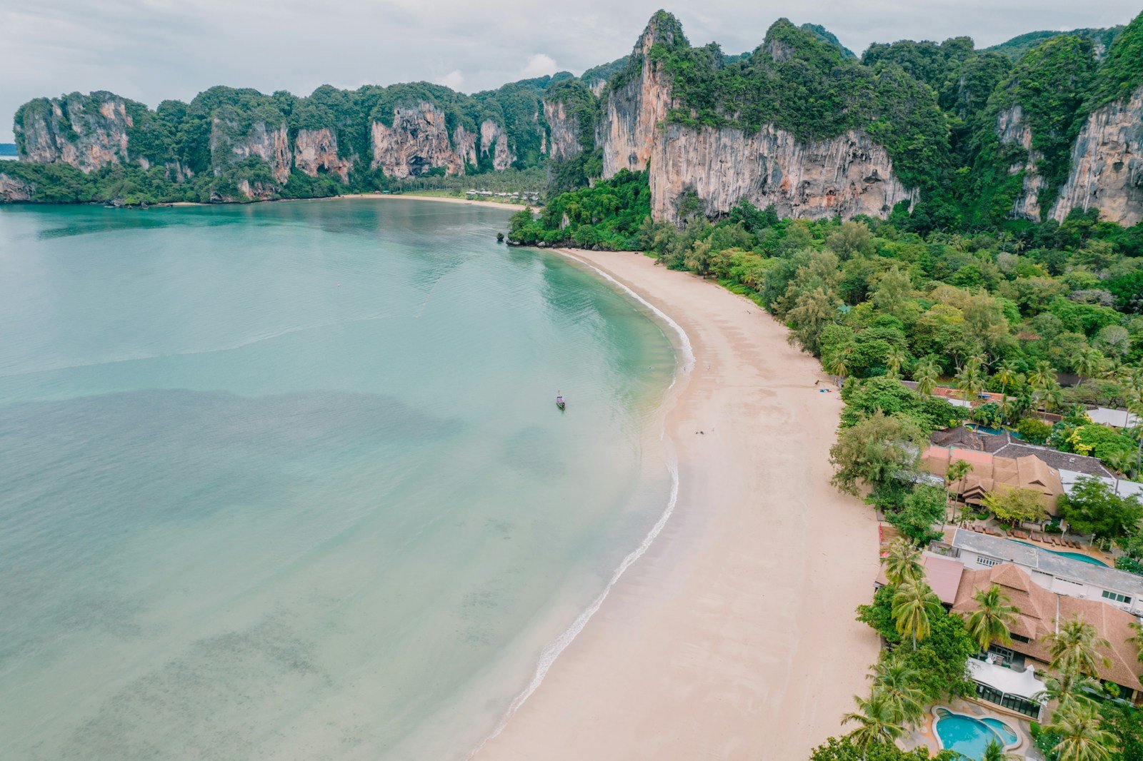 Turquoise waters and limestone cliffs at Railay Beach, Thailand.